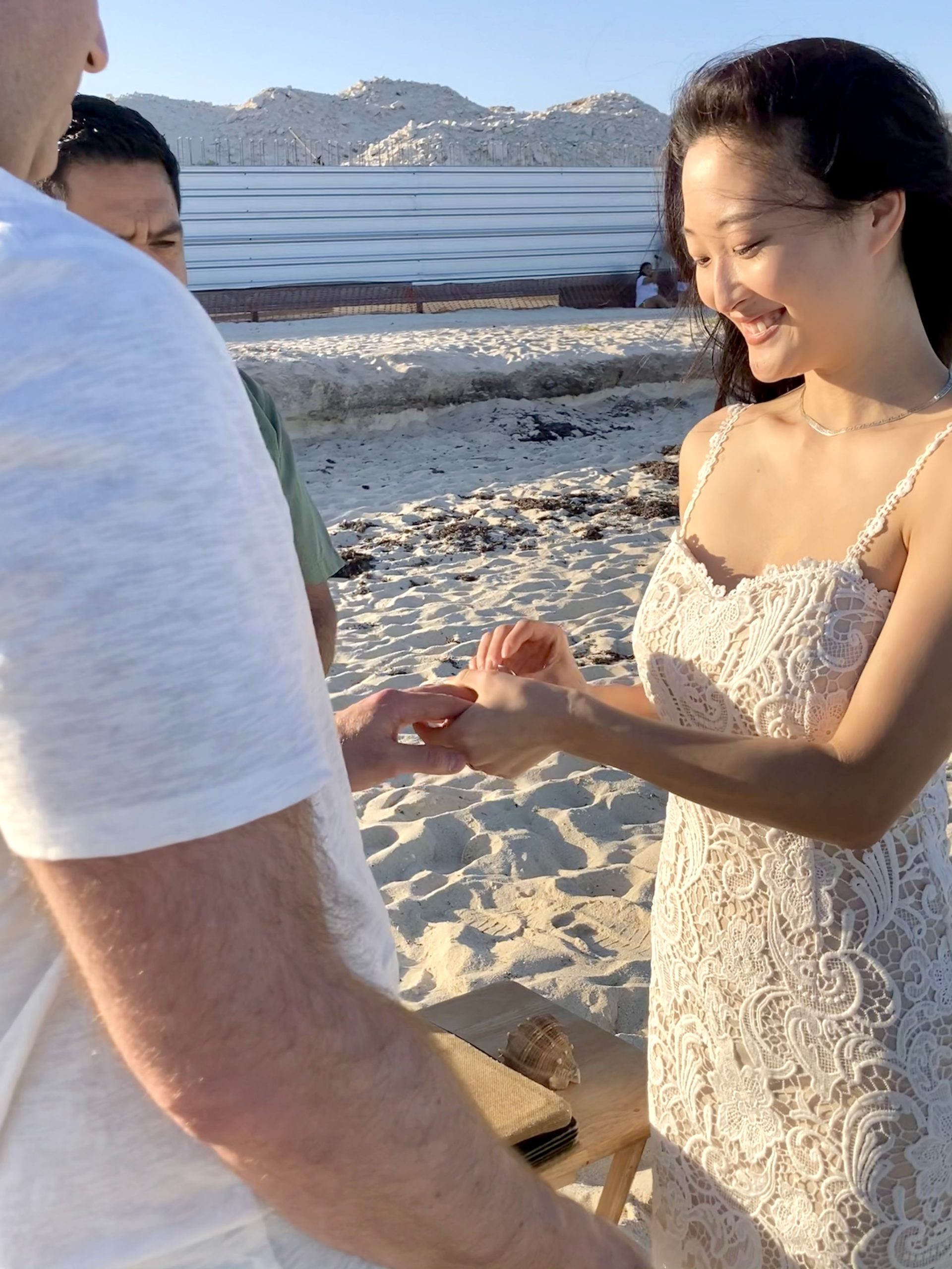 Exchanging rings on the beach